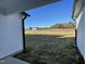 View from covered patio of large backyard with new houses at 77 Heatherglenn Cir, Princeton, NC 27569