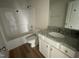 Bathroom featuring a shower/tub, vanity with granite countertop and wood cabinets at 77 Heatherglenn Cir, Princeton, NC 27569