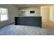 Modern kitchen featuring a breakfast bar, white cabinets, and stainless steel appliances at 77 Heatherglenn Cir, Princeton, NC 27569