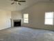 Spacious living room with a fireplace, high ceilings, and lots of natural light at 77 Heatherglenn Cir, Princeton, NC 27569