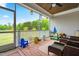 Relaxing screened back porch with comfortable seating and outdoor decor at 81 N Lumina Ln, Clayton, NC 27527