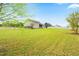 Spacious backyard with a white picket fence and mature trees at 81 N Lumina Ln, Clayton, NC 27527