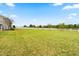 Large backyard with lush green grass and a white fence at 81 N Lumina Ln, Clayton, NC 27527