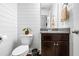 Charming powder room featuring shiplap walls, granite countertop, and modern fixtures at 81 N Lumina Ln, Clayton, NC 27527