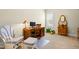 Bright bedroom with a wooden desk, unique chair, and a decorative wooden tractor at 81 N Lumina Ln, Clayton, NC 27527