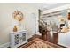 Inviting foyer showcases wood floors, a decorative cabinet, and seamless flow into the home's living spaces at 81 N Lumina Ln, Clayton, NC 27527