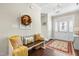 Welcoming foyer with wood floors, bench seating, and natural light filtering through the glass paneled front door at 81 N Lumina Ln, Clayton, NC 27527