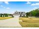 Beautifully landscaped single-Gathering home with a long driveway and a well-maintained yard in a serene setting at 81 N Lumina Ln, Clayton, NC 27527