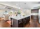Stylish kitchen features a granite island, pendant lighting, and is open to the living room, ideal for entertaining at 81 N Lumina Ln, Clayton, NC 27527