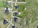 Aerial view showcasing residential neighborhood with well-maintained lawns and green spaces at 834 November Ln, Willow Springs, NC 27592