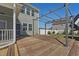 Spacious backyard with wooden deck and pergola, perfect for outdoor enjoyment at 834 November Ln, Willow Springs, NC 27592