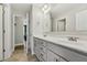 Bathroom featuring double sinks, gray cabinets, and tiled flooring at 834 November Ln, Willow Springs, NC 27592