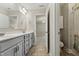 Bright bathroom with double sink vanity and shower with tile surround at 834 November Ln, Willow Springs, NC 27592