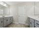 Bathroom featuring double vanities, tile floors and great counter space at 834 November Ln, Willow Springs, NC 27592