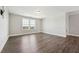 Bright bedroom features wood-look floors, neutral paint, and a window offering plenty of natural light at 834 November Ln, Willow Springs, NC 27592