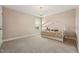 This bedroom has a carpeted floor, neutral colored walls and a window with natural light at 834 November Ln, Willow Springs, NC 27592