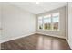 Sunny bedroom with three windows offering natural light and views of the outdoors at 834 November Ln, Willow Springs, NC 27592