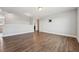 Open bonus room with wood floors, neutral paint, and tv wall mount at 834 November Ln, Willow Springs, NC 27592