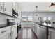 Spacious kitchen with stainless appliances, stone countertops and eat in island with seating at 834 November Ln, Willow Springs, NC 27592