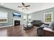 Cozy living room with fireplace, comfortable seating, and abundant natural light at 834 November Ln, Willow Springs, NC 27592