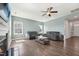 Bright living room featuring a fireplace, neutral paint, and wood floors at 834 November Ln, Willow Springs, NC 27592