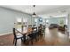 Open concept living spaces include dining area, living room with fireplace, and access to the patio at 834 November Ln, Willow Springs, NC 27592