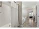 The main bathroom features a soaking tub, shower and entrances into the main bedroom and hallway at 834 November Ln, Willow Springs, NC 27592