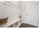 Mudroom with coat hooks, storage bench, and stylish accents at 834 November Ln, Willow Springs, NC 27592