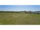 Expansive grassy yard with scattered trees, offering plenty of outdoor space at 834 November Ln, Willow Springs, NC 27592