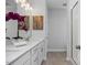 Bathroom with double vanity, modern fixtures, and an oversized mirror at 88 Baldwin St, Lillington, NC 27546