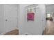 Inviting entryway with coat hooks, decorative bag, and a view into the living area at 88 Baldwin St, Lillington, NC 27546
