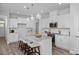 Beautiful kitchen featuring granite counters, stainless appliances, pendant lighting, and stylish island at 88 Baldwin St, Lillington, NC 27546