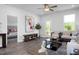 Cozy living room with hardwood floors, neutral tones, and natural light at 88 Baldwin St, Lillington, NC 27546