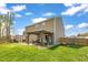 Backyard featuring a well-maintained lawn, gazebo, and patio, perfect for outdoor activities at 1000 Milkweed Ct, Zebulon, NC 27597