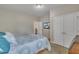 Comfortable bedroom with neutral walls, a bed, and closet with double doors at 1000 Milkweed Ct, Zebulon, NC 27597