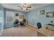 Home office space with blue walls, a ceiling fan, and a computer workstation at 1000 Milkweed Ct, Zebulon, NC 27597