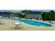 Community pool with chairs and tables for residents to enjoy at 1000 Milkweed Ct, Zebulon, NC 27597