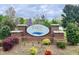 Taryn Lake community sign with brick base and colorful spring flowers and landscaping at 1000 Milkweed Ct, Zebulon, NC 27597