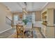 A bright dining room with hardwood floors and a large window at 1000 Milkweed Ct, Zebulon, NC 27597