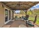 Relaxing gazebo with a fan and furniture, ideal for outdoor living and entertainment space at 1000 Milkweed Ct, Zebulon, NC 27597