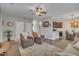 Inviting living space offering hardwood floors, a ceiling fan, comfortable seating, and an open layout at 1000 Milkweed Ct, Zebulon, NC 27597