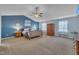 Spacious main bedroom with vaulted ceiling, ceiling fan, and large wooden furniture at 1000 Milkweed Ct, Zebulon, NC 27597
