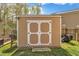 Outdoor shed offers additional storage for lawn equipment and tools in a backyard at 1000 Milkweed Ct, Zebulon, NC 27597
