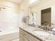 Bathroom with granite countertop, tub-shower combination, and towel rack at 103 Thornwhistle Pl, Garner, NC 27529