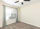 Neutral bedroom showcasing a ceiling fan, carpet flooring, and a window at 103 Thornwhistle Pl, Garner, NC 27529