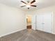 Bedroom featuring neutral walls, carpeted floor, ceiling fan, and closet at 103 Thornwhistle Pl, Garner, NC 27529