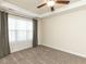 Bedroom features a trey ceiling, ceiling fan, carpet, window and soft window dressing at 103 Thornwhistle Pl, Garner, NC 27529
