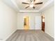 Spacious bedroom with carpet, trey ceiling, and walk-in closet and kitchen access at 103 Thornwhistle Pl, Garner, NC 27529