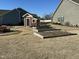 Picturesque community garden features raised beds and a charming garden shed at 103 Thornwhistle Pl, Garner, NC 27529