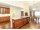 Spacious kitchen with hardwood floors, stainless steel appliances, and granite countertops at 103 Thornwhistle Pl, Garner, NC 27529